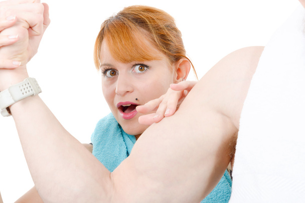  woman examining flexing biceps of her muscular boyfriend  - Foto, immagini