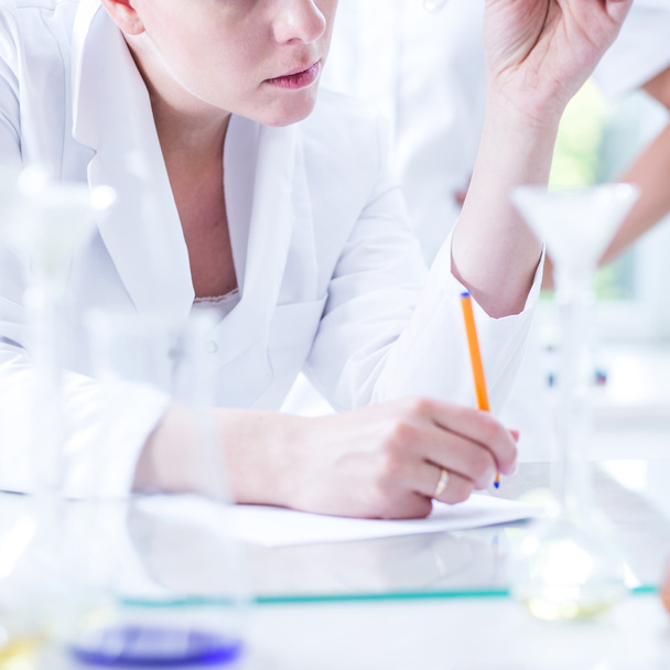 Female scientist during work - Foto, afbeelding