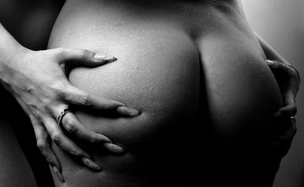 Women's hands on his buttocks - Photo, Image