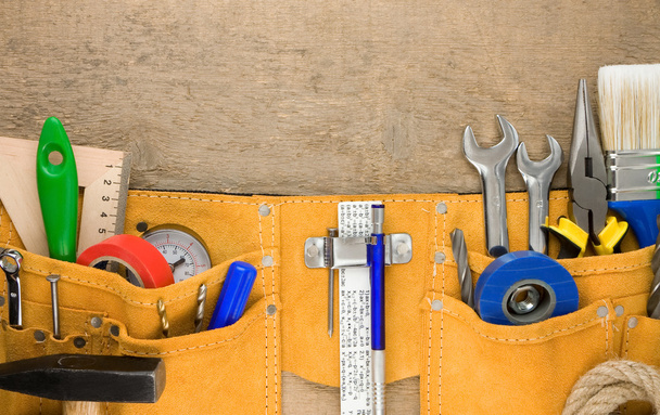 Set of tools in belt on wood - Fotoğraf, Görsel