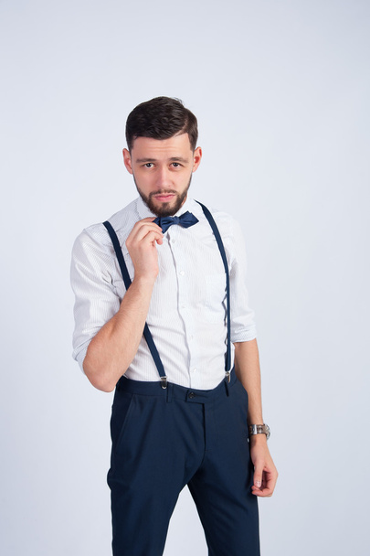 Trendy guy straightens his tie butterfly - Photo, Image