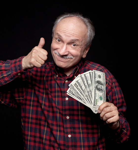 oudere man weergegeven: fan van geld - Foto, afbeelding