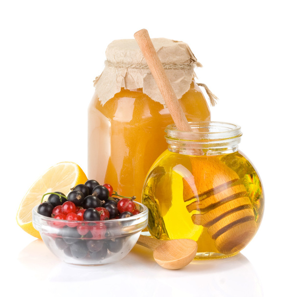 Glass jar full of honey and berry - Foto, Imagem