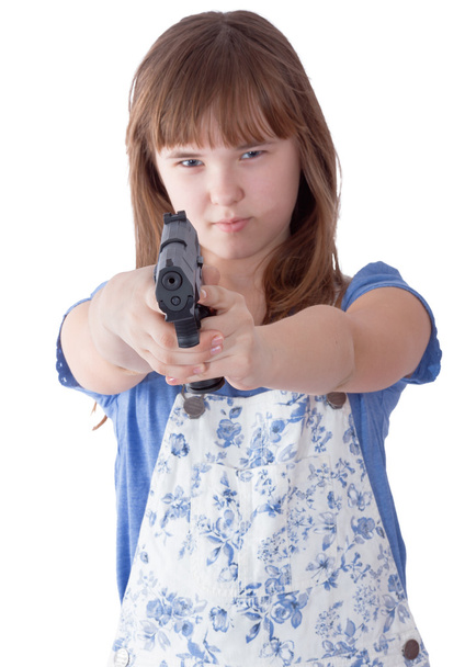 Pretty teen girl with a gun - Foto, afbeelding