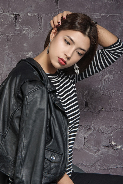 Portrait of an Asian girl wearing a striped shirt  - Fotoğraf, Görsel