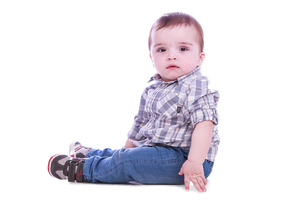 Portrait of small boy in blue trousers - Foto, afbeelding