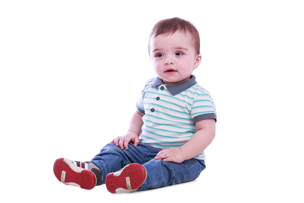 Portrait of small boy in blue trousers - Foto, imagen