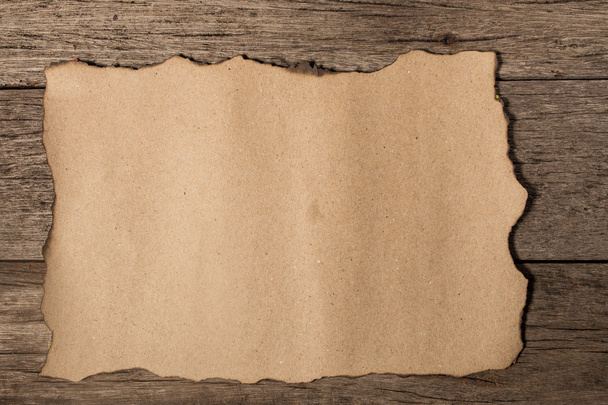 old paper on brown aged wood - Φωτογραφία, εικόνα