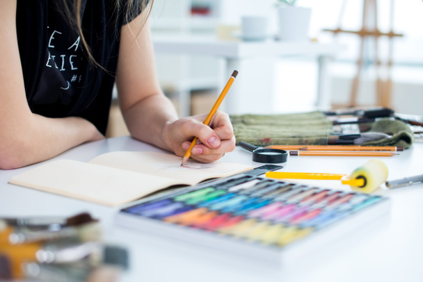  female painter drawing draft at sketchbook   - Photo, Image