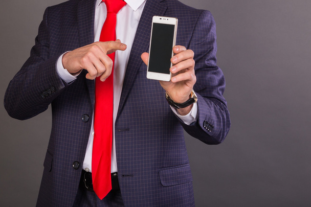 A guy in a nice suit with a mobile phone - Foto, Imagen