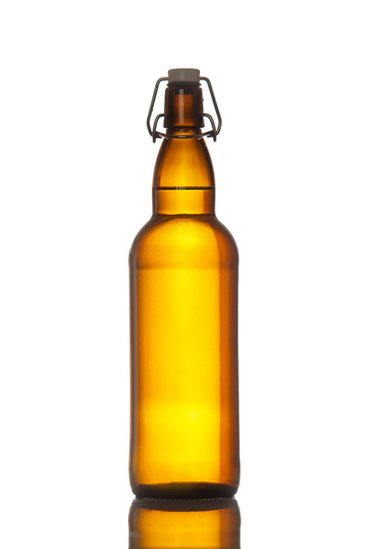Bottle of beer with drops isolated - Photo, Image