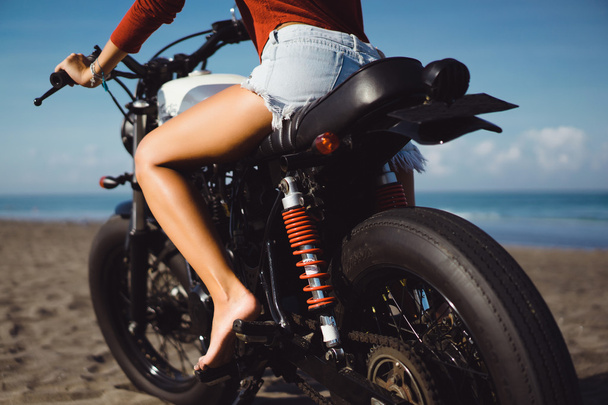  woman sitting on vintage custom motorcycle - Photo, Image