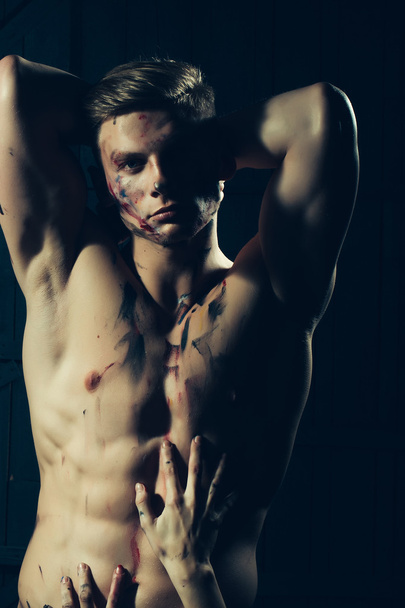 Muscular paited man and hands - Valokuva, kuva