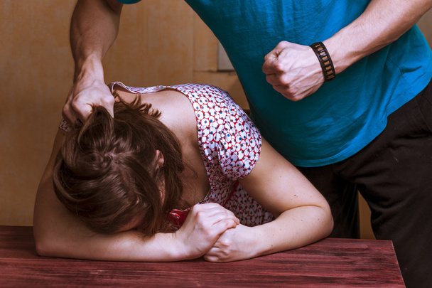 Man beating up his wife - Фото, изображение