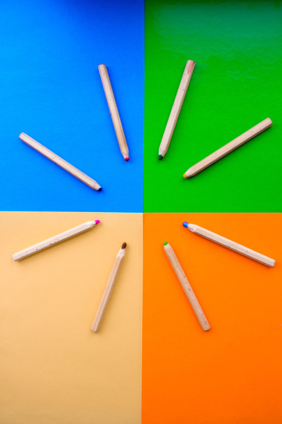 Colorful picture of wooden pencils circled around edges of rainbow colors. - Фото, зображення
