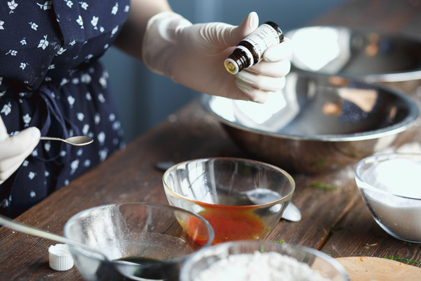 Preparation of bath bombs. Ingredients and floral decor on a wooden vintage table. - Foto, Bild
