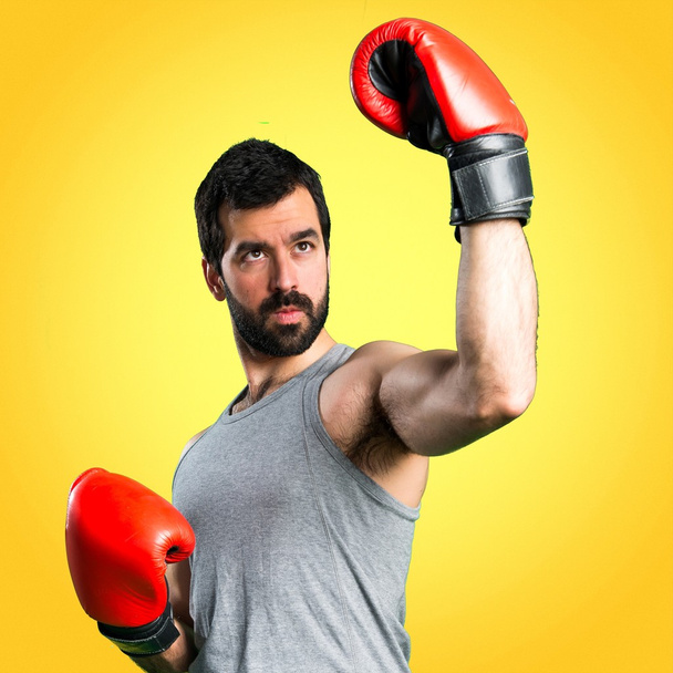 Sportman with boxing gloves - Foto, Imagen
