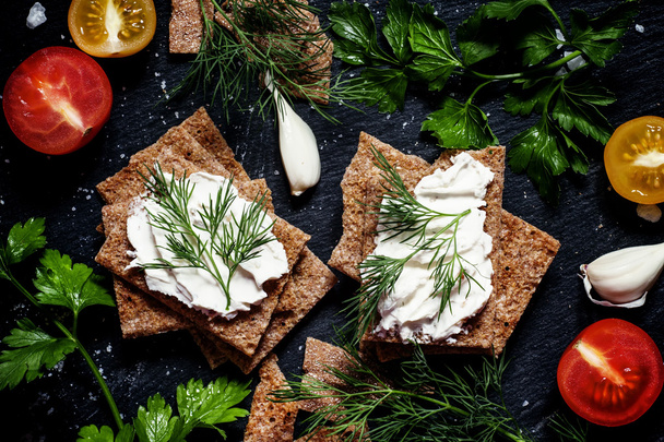 Crisp rye bread with soft curd cheese with herbs and spices  - Zdjęcie, obraz