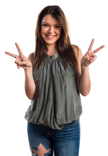 Young girl doing victory gesture - Foto, immagini
