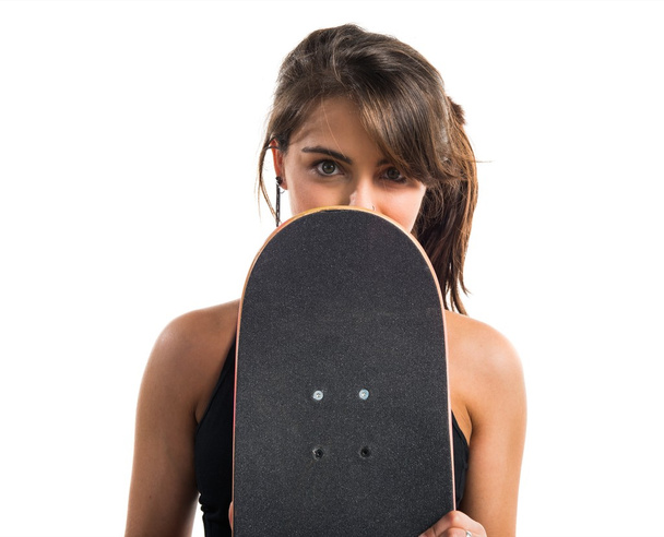 Young girl with skate over white background - Photo, Image