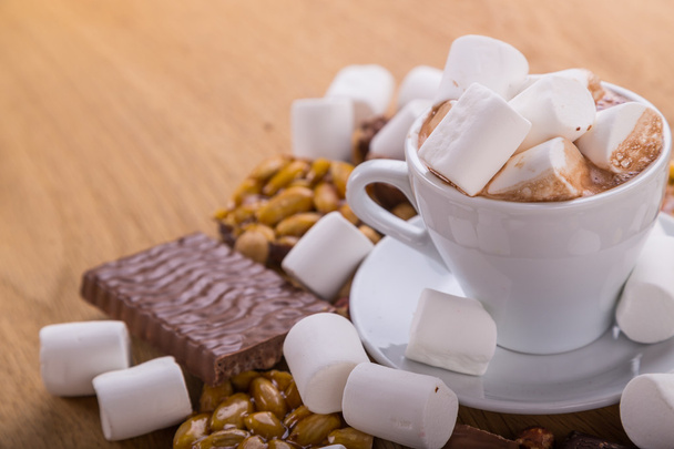 Various sweets, marshmallows, chocolate with nuts - Photo, Image