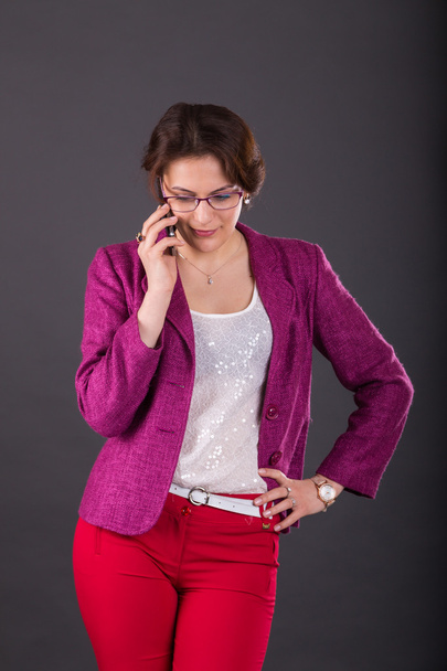 Business girl with a folder for papers and telephone - 写真・画像