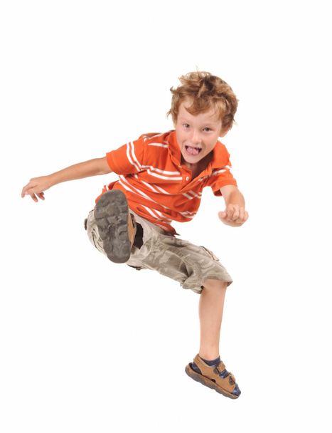 Jumping boy isolated over white background - Fotografie, Obrázek