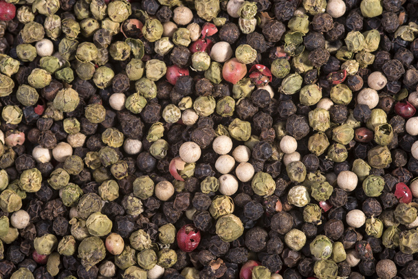 colored peppercorns as a background - Photo, Image