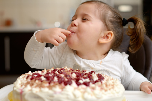 Cute little girl eating cake - Photo, Image