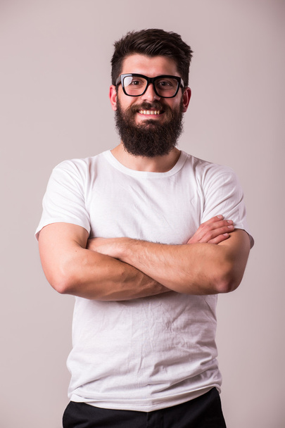 Bearded man in glasses with crossed hands  - Foto, Imagem