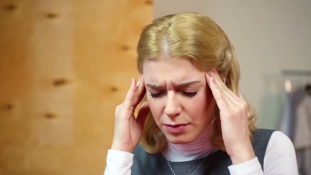 Blond woman having headache, nervous breakdown at work.  Stress and problems - Felvétel, videó