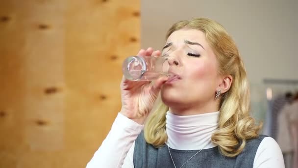 Pretty female taking pills for toothache. Blond woman having strong dental pain - Záběry, video