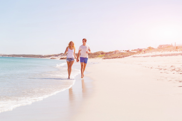 Romantic young couple on the beach - Photo, image
