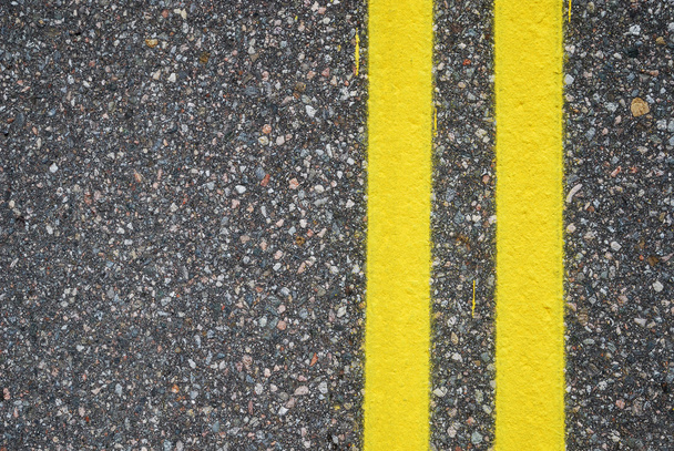 Close-up of road surfacing with lane lines - Foto, Imagen