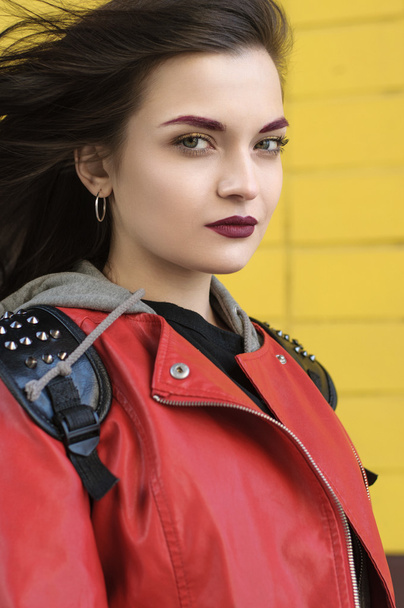 Portrait of a girl in a red jacket - Фото, изображение