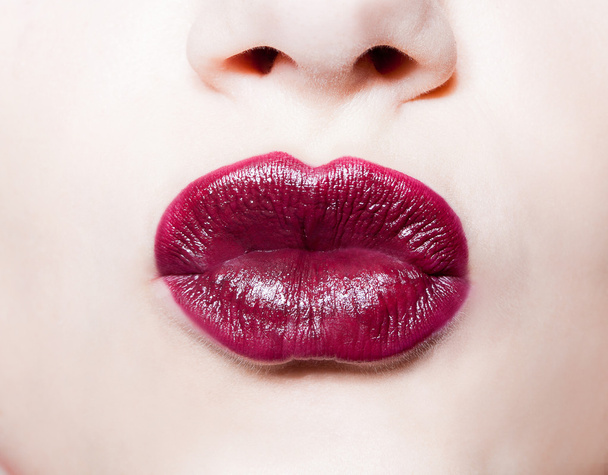closeup portrait of  woman's  dark red lips  - Foto, afbeelding