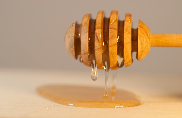 macro detail of honey spoon - Φωτογραφία, εικόνα