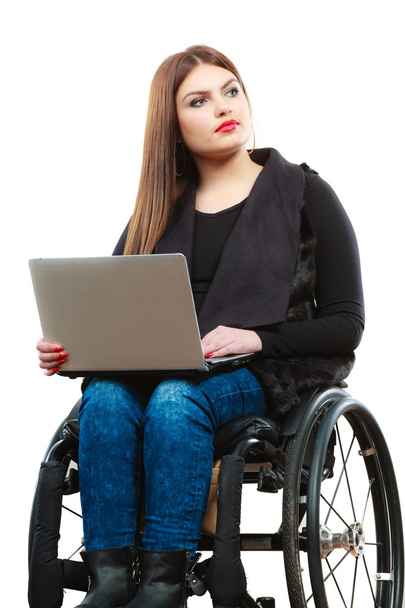 Woman invalid girl on wheelchair using computer - Foto, afbeelding