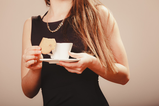Woman with cup of coffee and cake - Photo, image