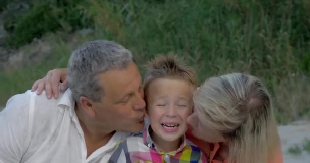 Grandparents kissing dear grandson - Footage, Video