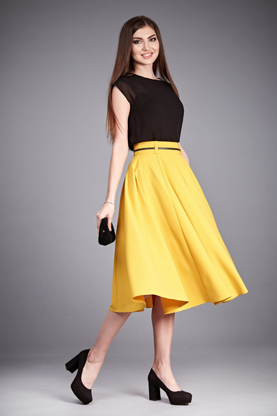 Beautiful sexy glamor woman lady long brunet hair makeup wear fashion clothes silk or cotton blouse trendy skirt lather shoes catalog in studio casual office clothes businesswoman accessory body bag - Foto, imagen