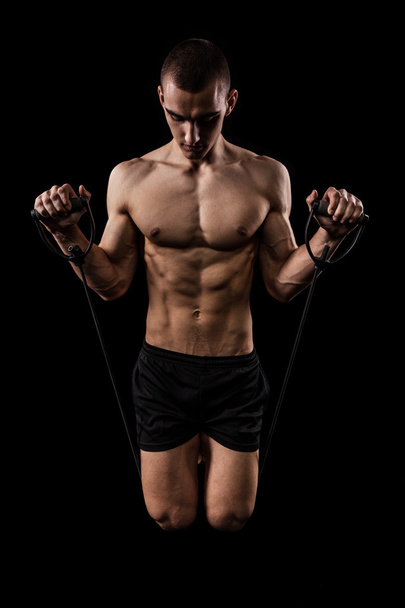 Fitness man isolated on black background - Foto, Imagen
