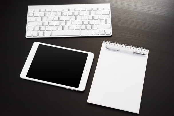Digital tablet on office table. - Фото, изображение