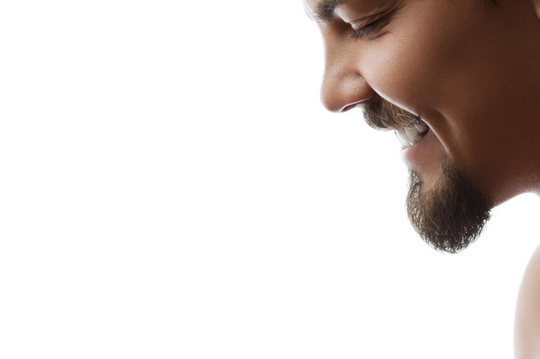 Happy young bearded man laughing - Photo, Image