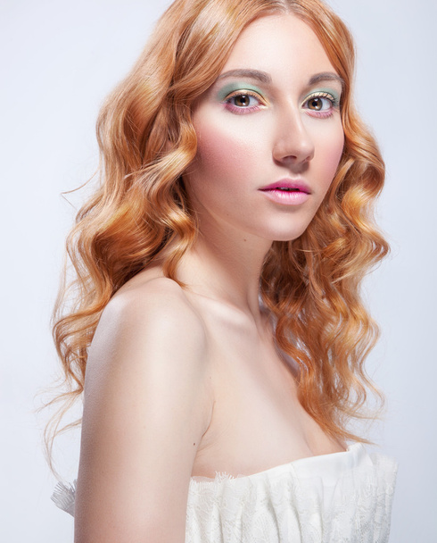 Romantic portrait of young red haired woman with tender spring m - Photo, Image