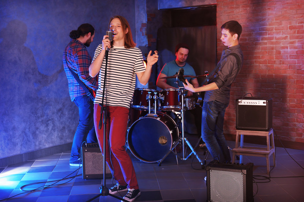 Music band performing on stage. - Valokuva, kuva