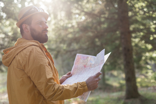 Hiker in nature. man in nature using map - Photo, Image