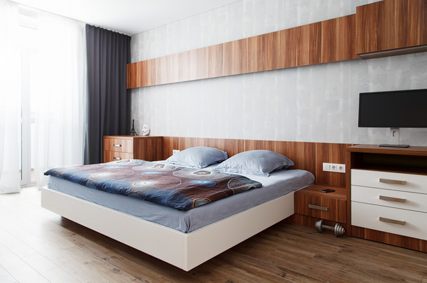Modern bedroom in a wooden finish - Φωτογραφία, εικόνα