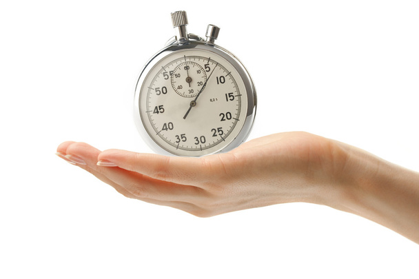 γυναικείο χέρι με ένα χρονόμετρο με διακόπτη - Φωτογραφία, εικόνα
