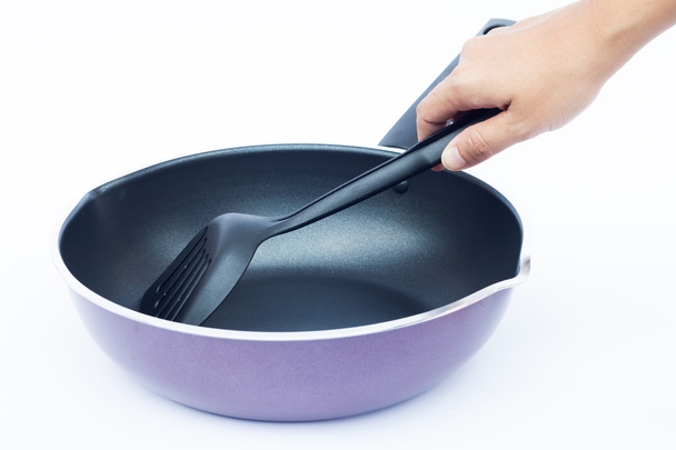 Hand with non stick frying pan on white background - Фото, изображение